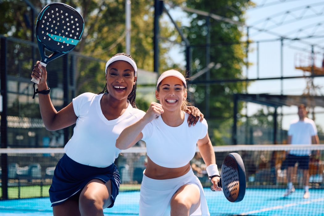 Happy,Female,Paddle,Tennis,Players,Celebrating,A,Match,Win,And